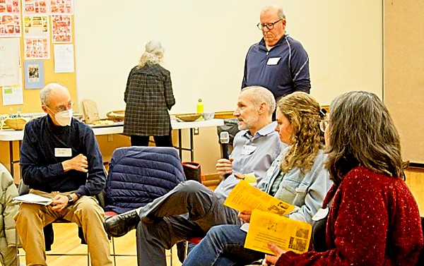 Several seated people talking.