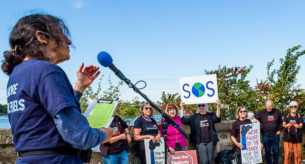 Judith Black, organizer of the "die-in," addresses demonstrators.